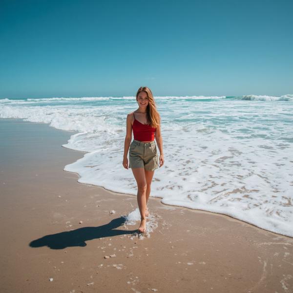 Woman Standing on Tropical Beach - graphicpicker.com